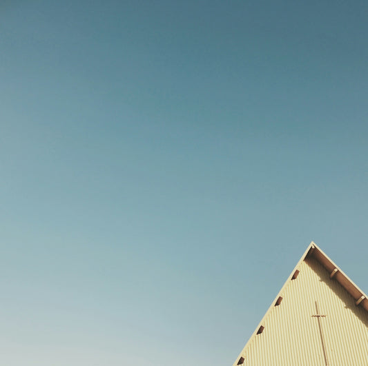 triangular building under blue sky