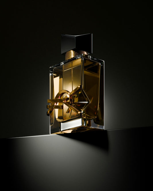 A bottle of perfume sitting on top of a table