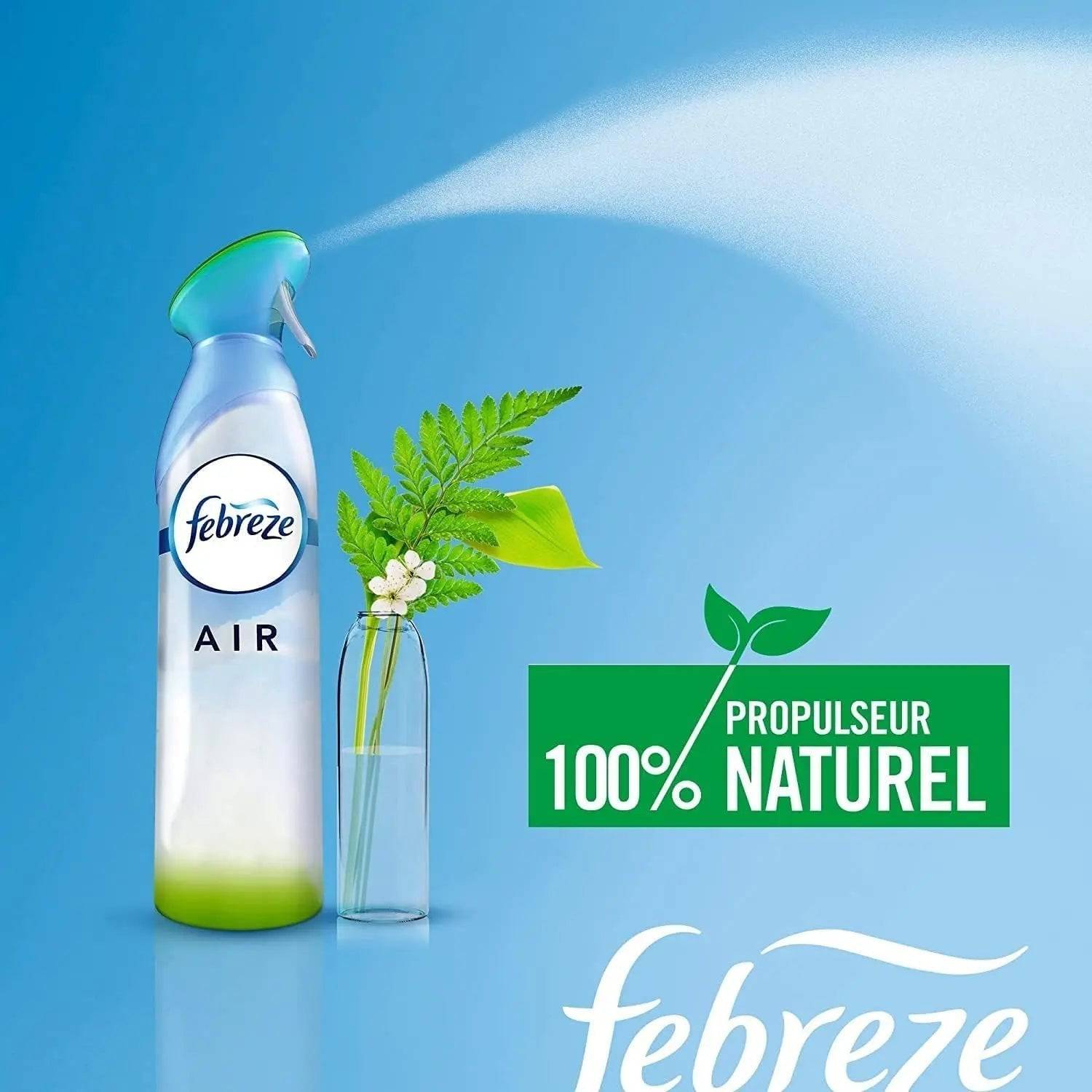 Spray Febreze Air avec propulseur 100% naturel, diffusant un parfum frais à côté d’un vase de plantes vertes, pour un intérieur sain.