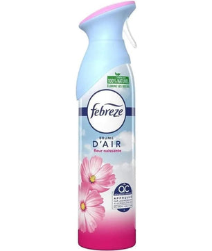 Spray désodorisant maison Febreze Fleur Naissante avec fleurs roses, conçu pour éliminer les odeurs et offrir une fraîcheur durable.